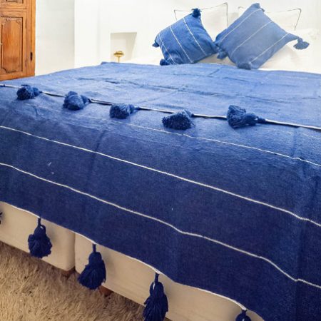 sky-blue-blanket-with-pom-poms-2